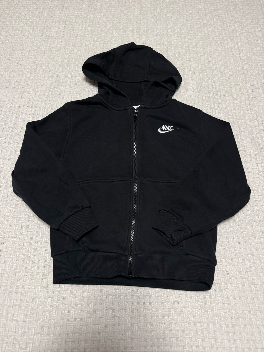 Nike black zip up youth hoodie size small.